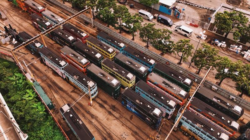 Aerial view of double-decker trams packed into a depot.